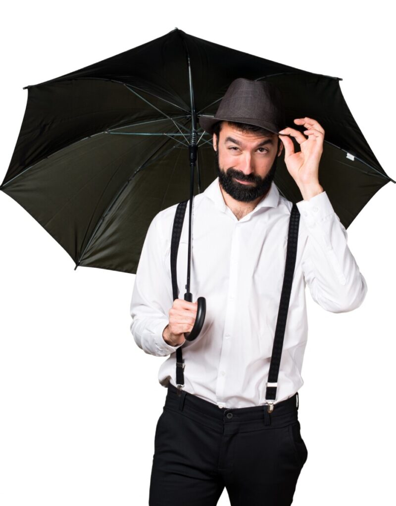 hipster man with beard holding an umbrella